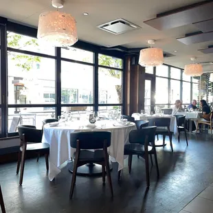 a dining room with tables and chairs
