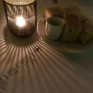 a plate of food and a candle on a table