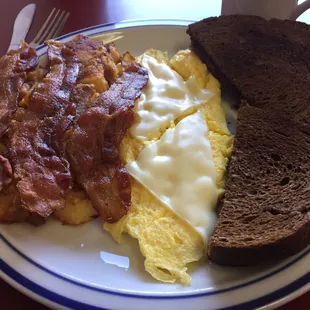 Delicious eggs, bacon, and rye.