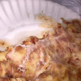 a slice of pizza on a paper plate