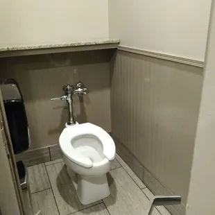 a toilet in a small bathroom