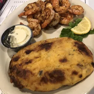 Grilled shrimp dinner with stuffed potato.