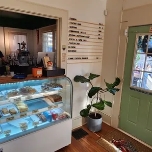 a bakery counter with pastries on display
