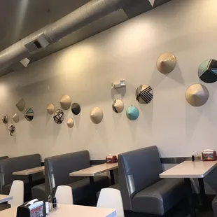 a restaurant with tables and booths
