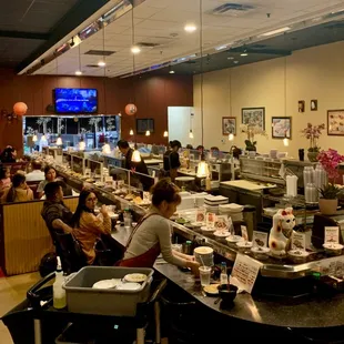 a busy restaurant with customers