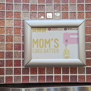 a sign for mom's cake batter
