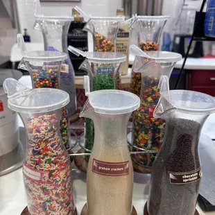 a variety of cereals in containers