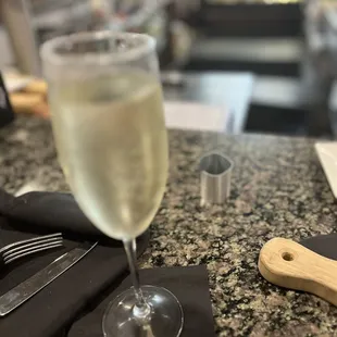 a glass of wine on a table