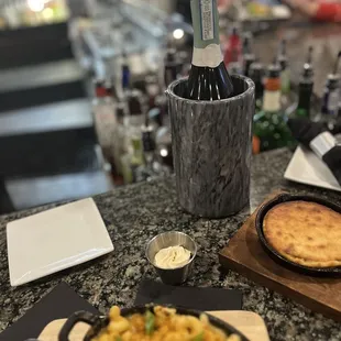 a plate of food and a bottle of wine