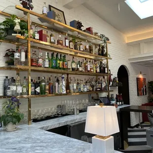 a bar with shelves of liquor