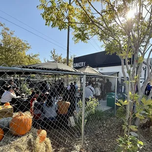 Picture of the bakery and outside seating from the parking lot.