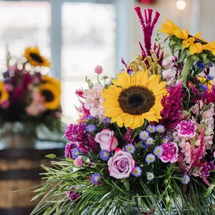 a flower arrangement in a barrel