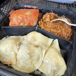 Stuffed cabbage (seasoned ground beef &amp; rice) sour krout (not hardly sour... seasoned and flavorful) and potato pierogis