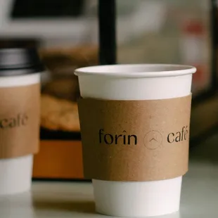 two cups of coffee on a counter