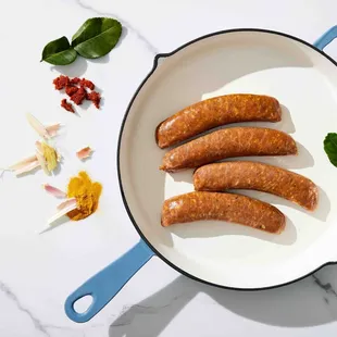 Thai Style SAI UA Sausage: Flavored with red curry paste, lemongrass, lime leaf, turmeric, tamari soy sauce, and other zesty spices.