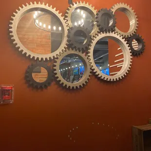 a clock and gears on the wall