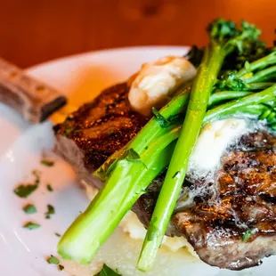 a piece of steak and broccoli