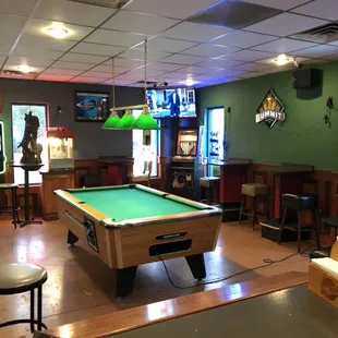a pool table in a bar