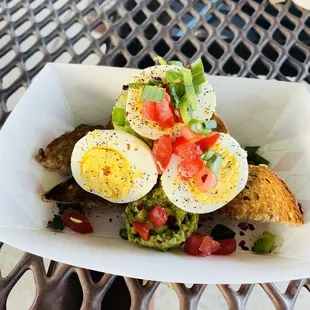 Toast and guacamole with deviled eggs