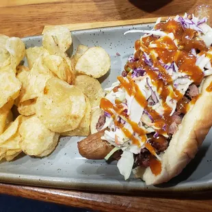 Veal Sausage topped with Brisket and coleslaw.