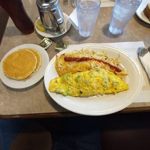 Three egg omelet with broccoli and Swiss cheese.