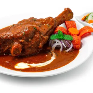 a plate of meat and vegetables
