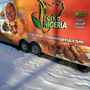 a food truck parked in the snow
