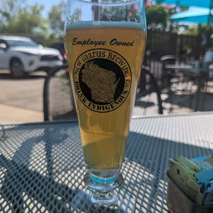a glass of beer on a table