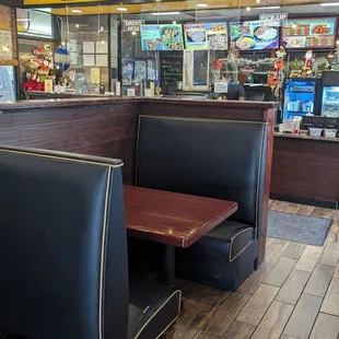 a restaurant with booths and tables