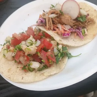 two tacos on a white plate