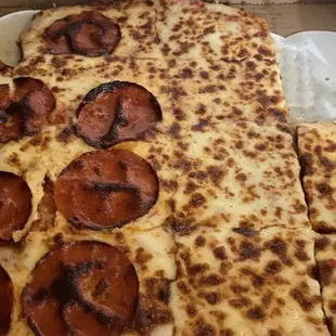 a slice of pepperoni pizza in a box