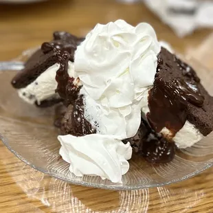 a chocolate cake with whipped cream on top