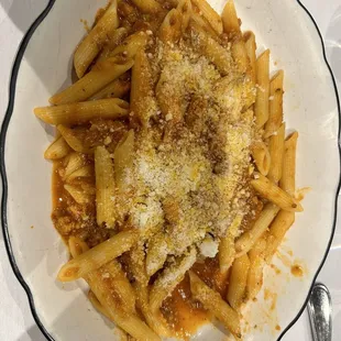 a plate of pasta with parmesan cheese