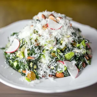 Kale Salad -  Brussels Sprouts, Golden Raisins
Pecorino, Egg, Almond, Citrus Vinaigrette