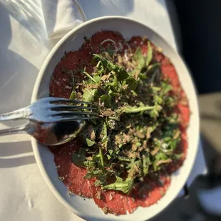 Beef carpaccio with truffles and kale