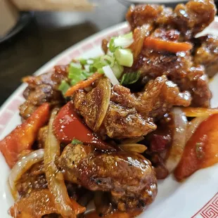 a plate of meat and vegetables