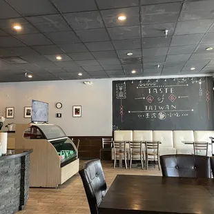 a restaurant with a chalkboard on the wall