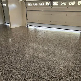 Black and white chip floor in my garage and golf cart garage.