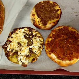 left to right top to bottom: cheese boat. safiha? (or i have it mixed up with lahem), Za'atar with cheese, and the lahem bel ajeen.