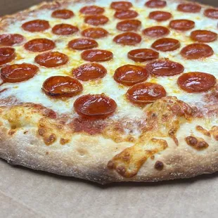 a pepperoni pizza in a box