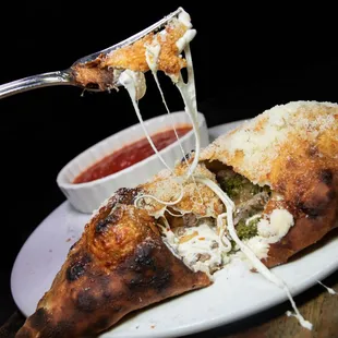  a piece of pizza with cheese and sauce