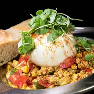  a scallop of egg with tomatoes and corn