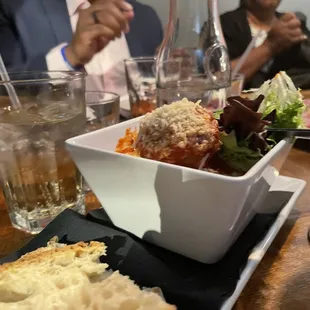 a plate of food and a glass of water