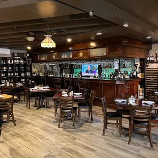 a dining area with tables and chairs