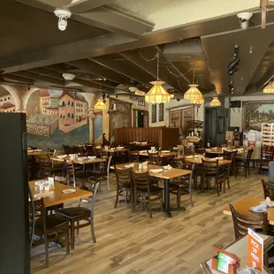 a dining area with tables and chairs