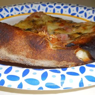 a slice of pizza on a plate