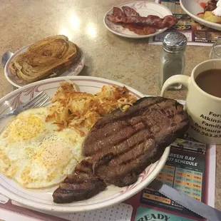 a plate of food and a cup of coffee
