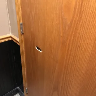 a door with a hole in it