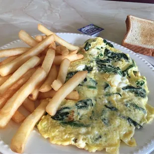Feta cheese &amp;spinach omelette, fries and white toast