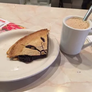 Blueberry pie and cappuccino.